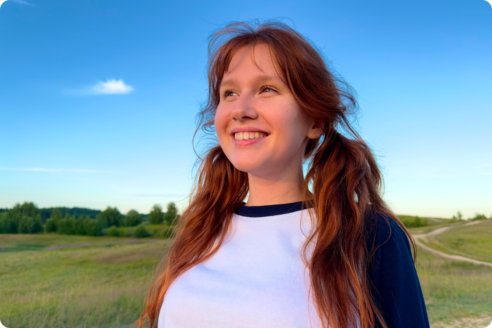 teenage girl looking optimistically into the future